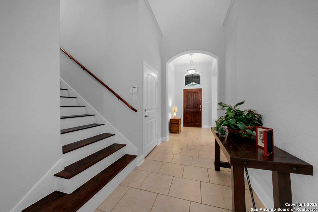 400 Bison Lane Cibolo, TX 78108 - Photo 15 of 34 a view of a hallway with wooden floor and a potted plant