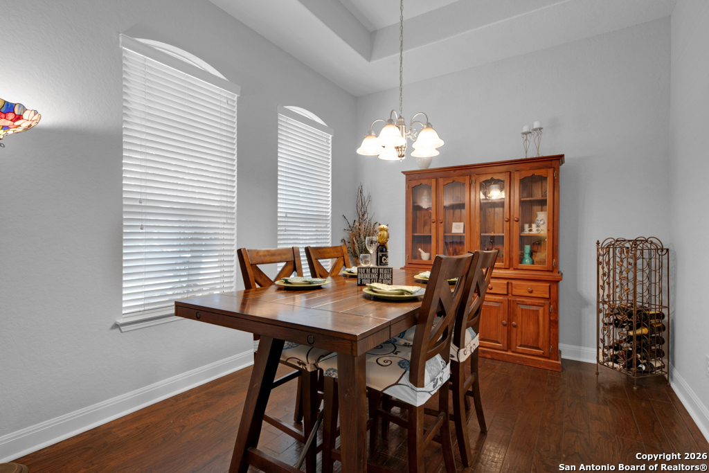 400 Bison Lane Cibolo, TX 78108 - Photo 16 of 34 a view of a dining room with furniture window and wooden floor