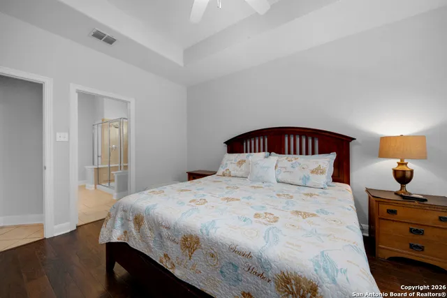 a bedroom with a bed and a dresser in it