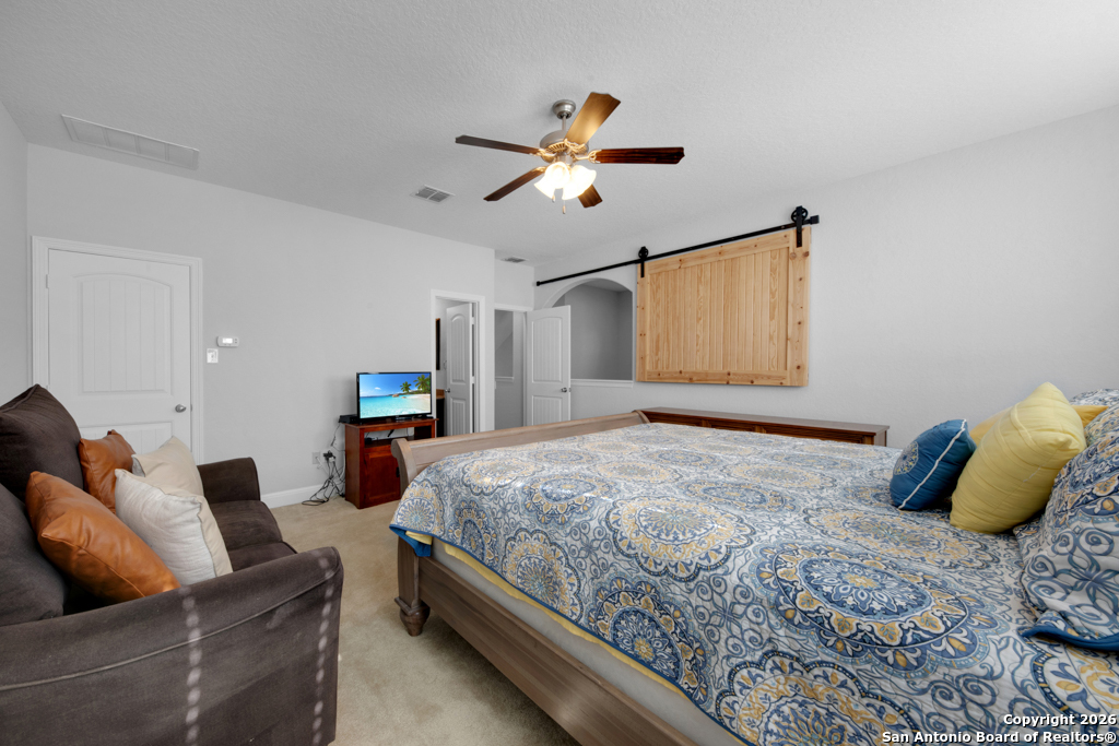 400 Bison Lane Cibolo, TX 78108 - Photo 29 of 34 a bedroom with bed and wooden floor