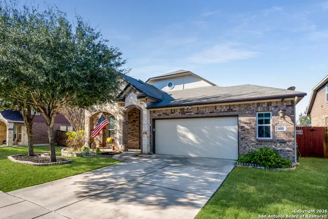 a front view of house with yard and green space