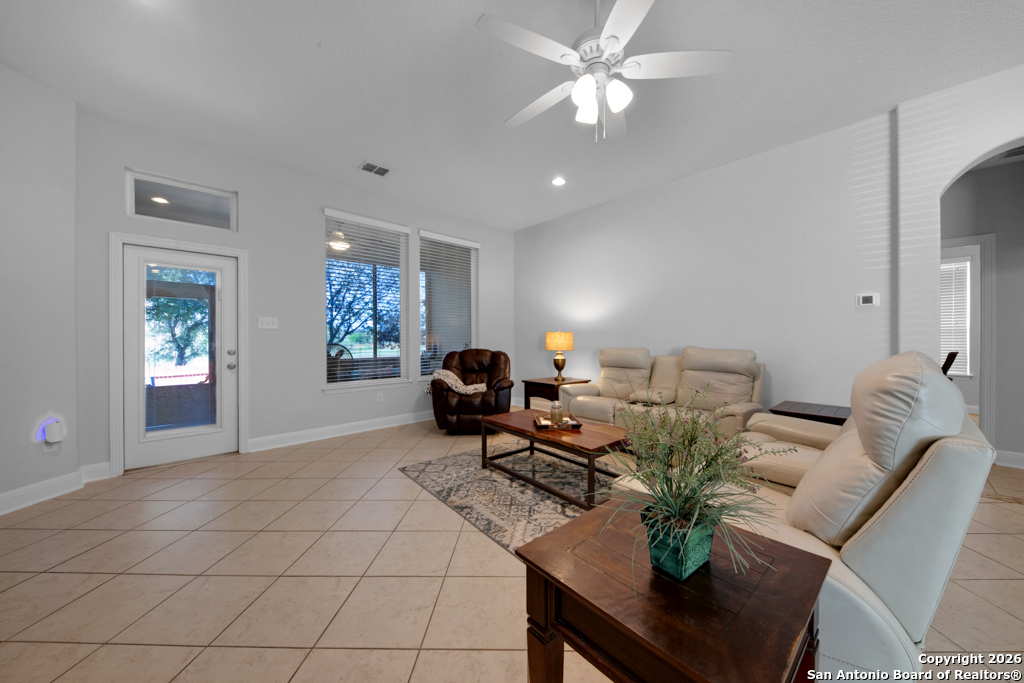 400 Bison Lane Cibolo, TX 78108 - Photo 6 of 34 a living room with furniture a chandelier and a window