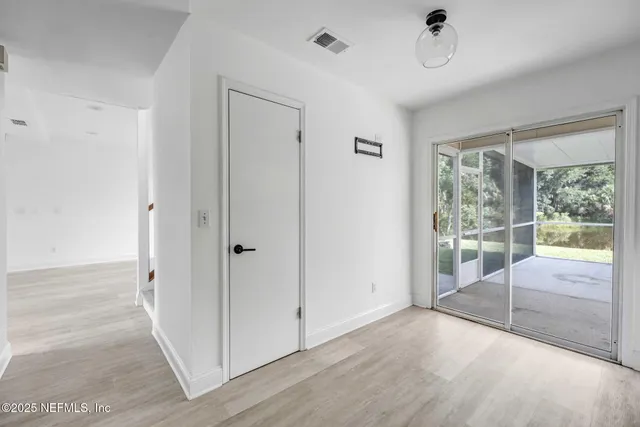 a view of livingroom with furniture wooden floor and windows