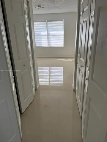 a bathroom with a double vanity sink a mirror and a bathtub