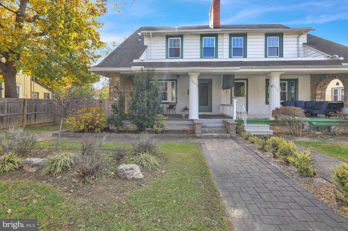 1314 Garfield Avenue Reading, PA 19610 - Photo 1 of 24 a front view of a house with garden