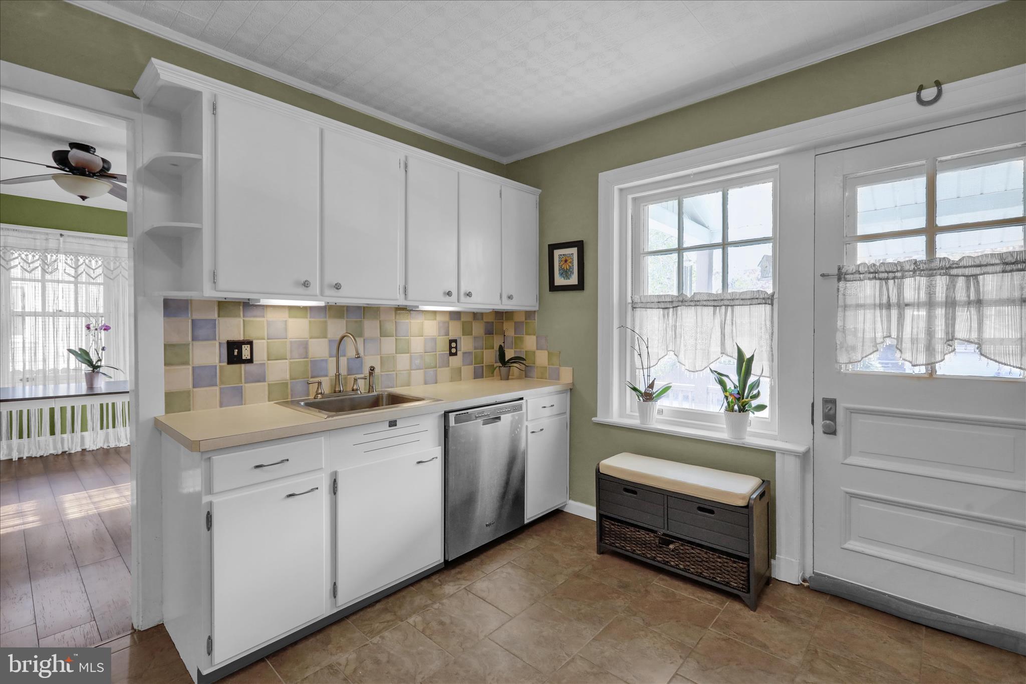 1314 Garfield Avenue Reading, PA 19610 - Photo 10 of 24 a kitchen with granite countertop white cabinets and white appliances