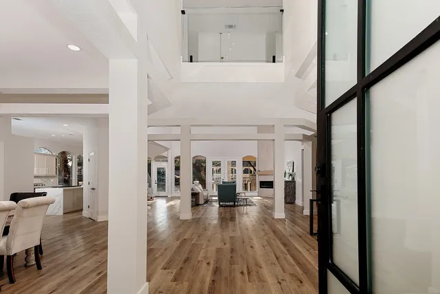 a bedroom with a bed and chandelier