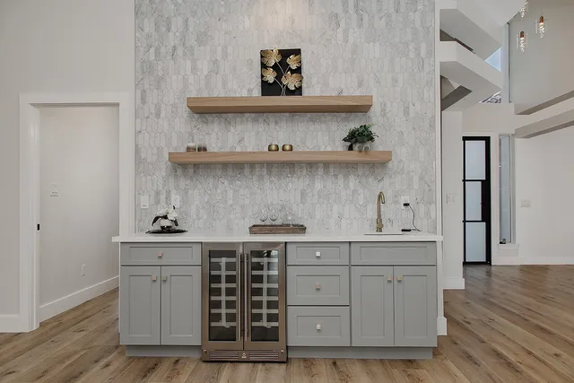 a view of a dining room with furniture a chandelier and wooden floor