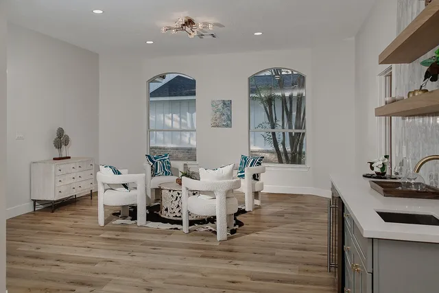 a view of a dining room with furniture window and wooden floor