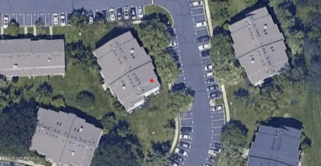 an aerial view of a house with outdoor space