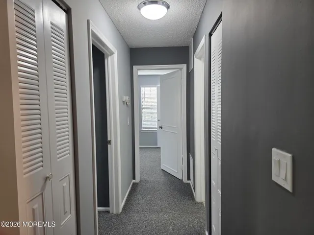 a view of a bathroom from a hallway