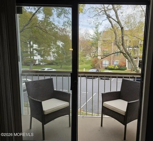 a view of a two chair in the balcony