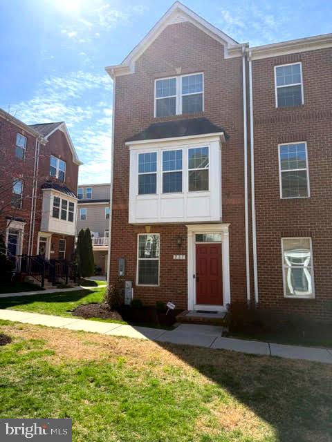 737 South Macon Street Baltimore, MD 21224 - Photo 1 of 1 a front view of a house with a yard