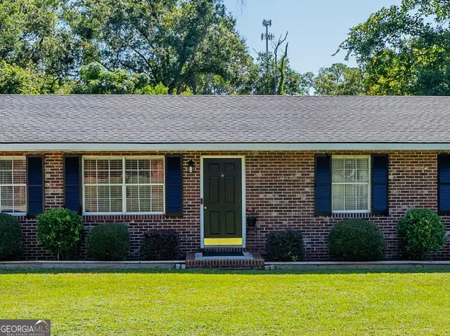 a view of house with a swimming pool