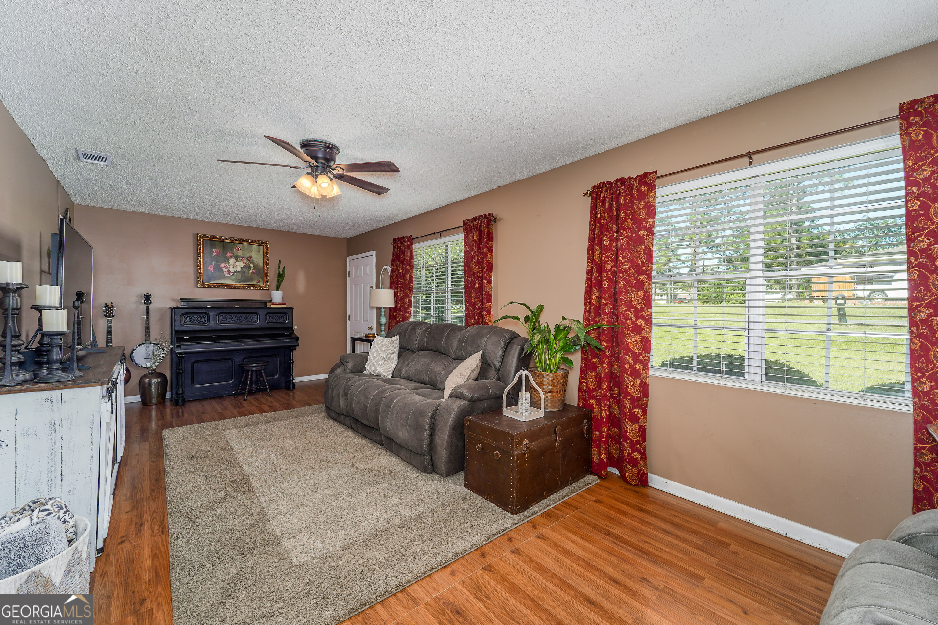 420 Jackson Street Blackshear, GA 31516 - Photo 18 of 31 a living room with furniture and a window