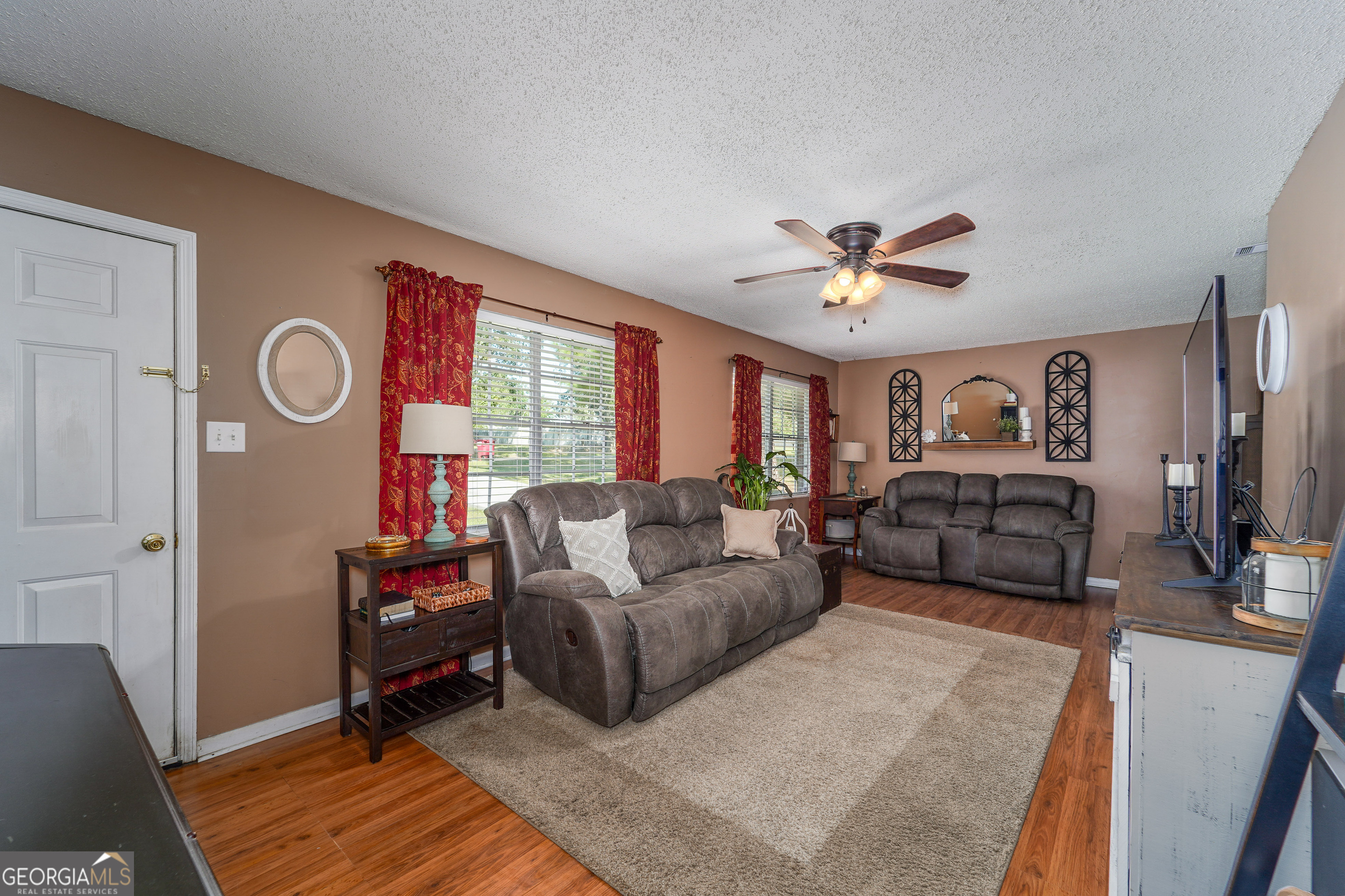 420 Jackson Street Blackshear, GA 31516 - Photo 19 of 31 a living room with furniture and a large window