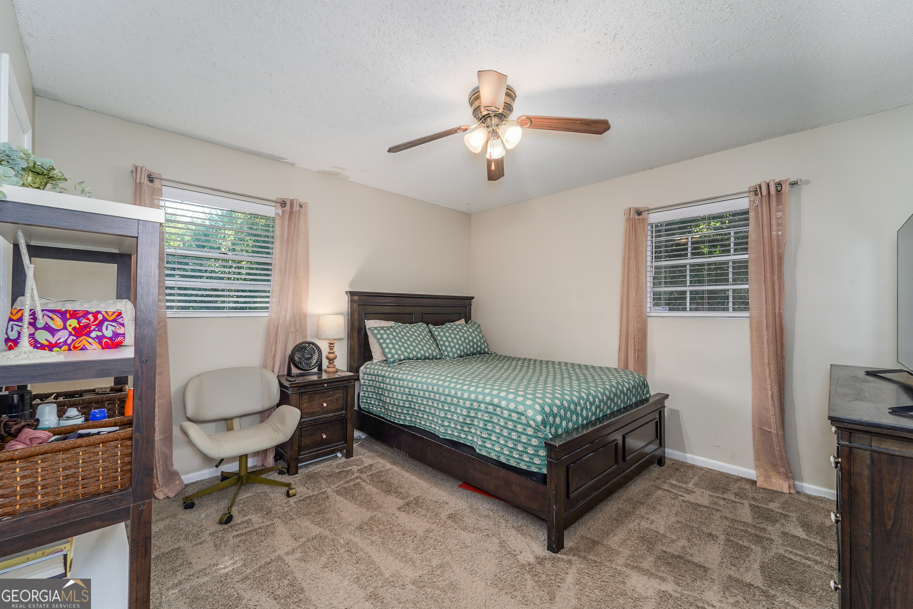 420 Jackson Street Blackshear, GA 31516 - Photo 25 of 31 a living room with furniture and a flat screen tv