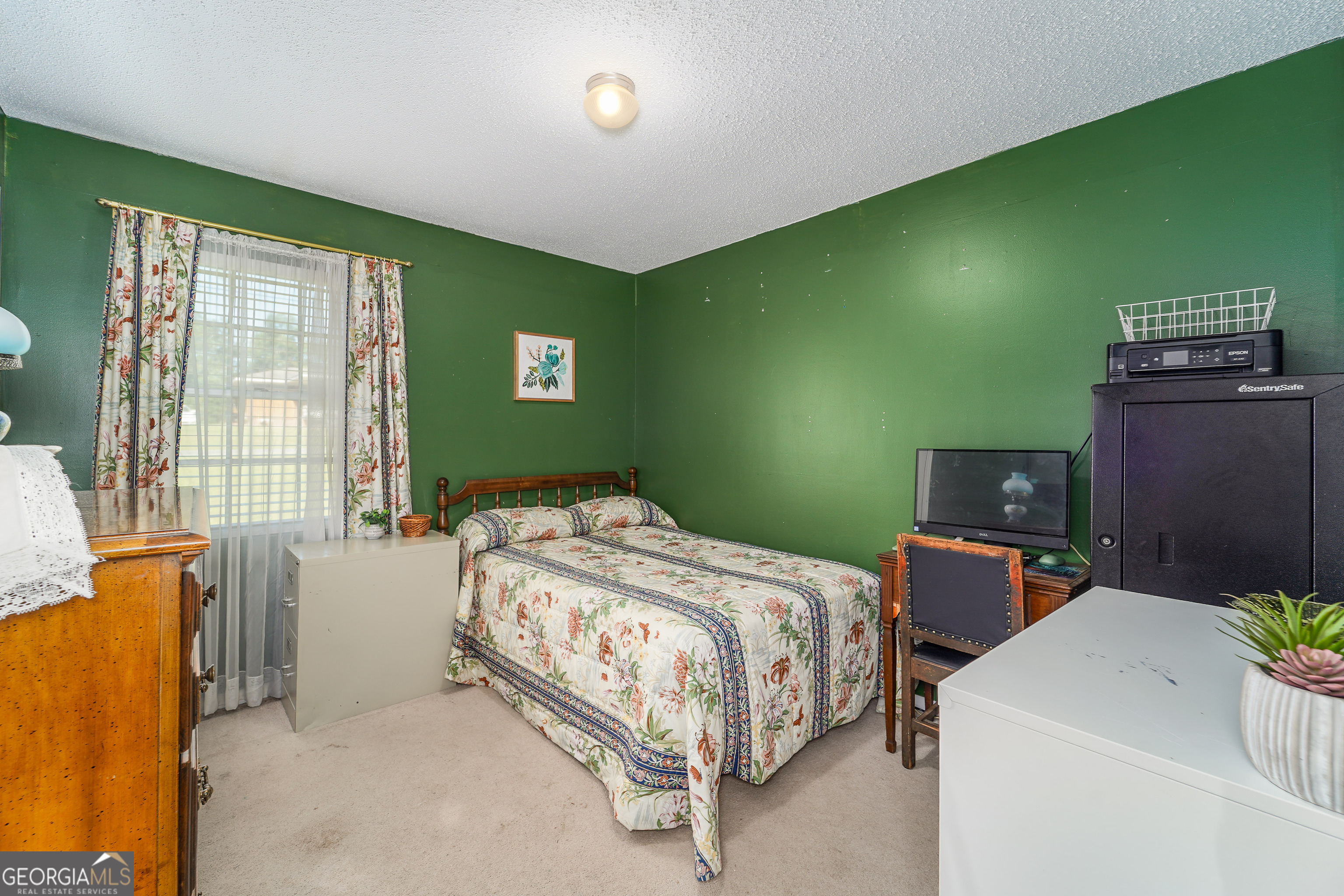 420 Jackson Street Blackshear, GA 31516 - Photo 26 of 31 a bedroom with a bed and a window
