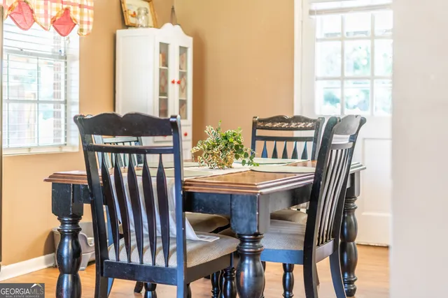 a view of a dining room with furniture window and outside view