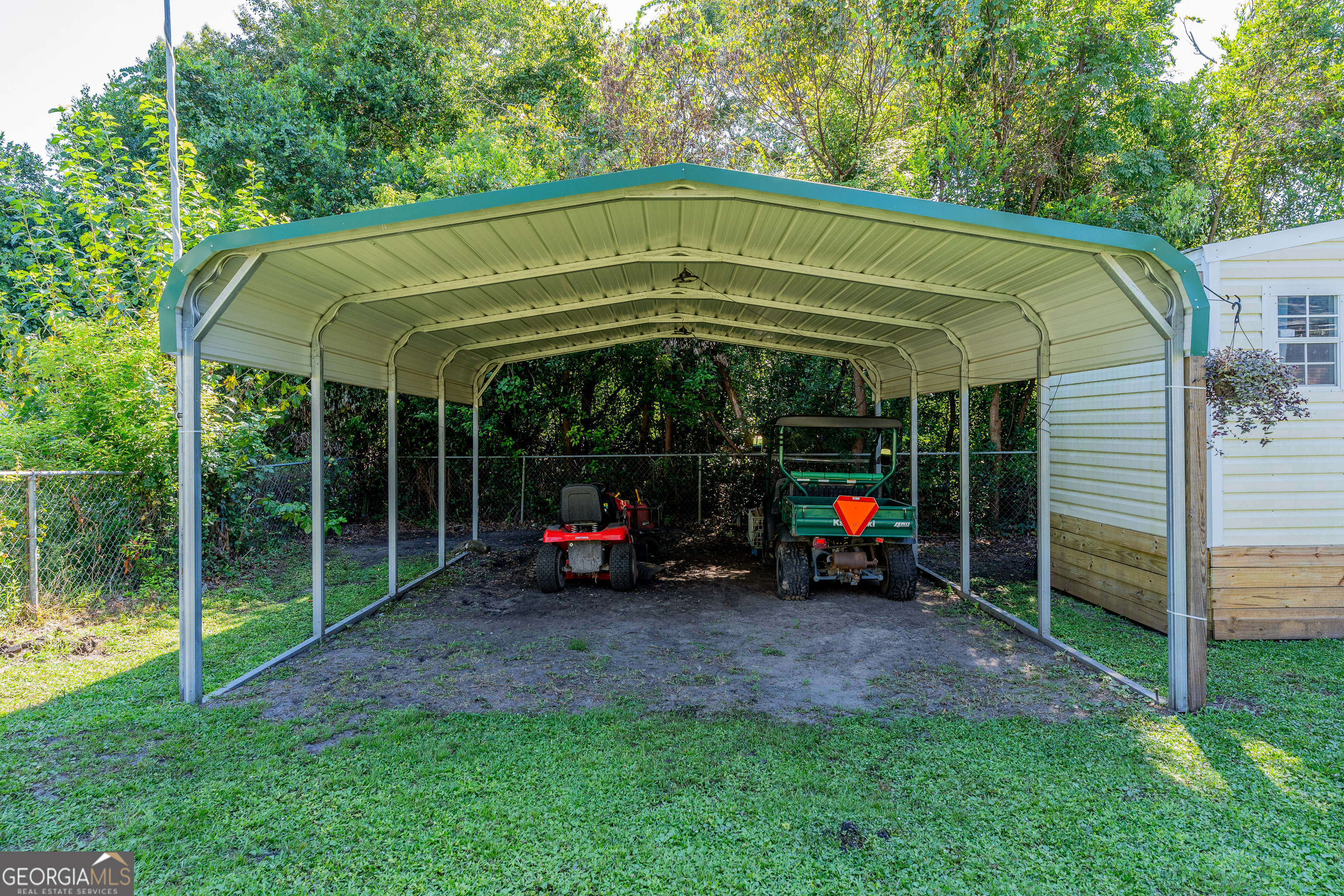 420 Jackson Street Blackshear, GA 31516 - Photo 7 of 31 a view of a car parked in the yard
