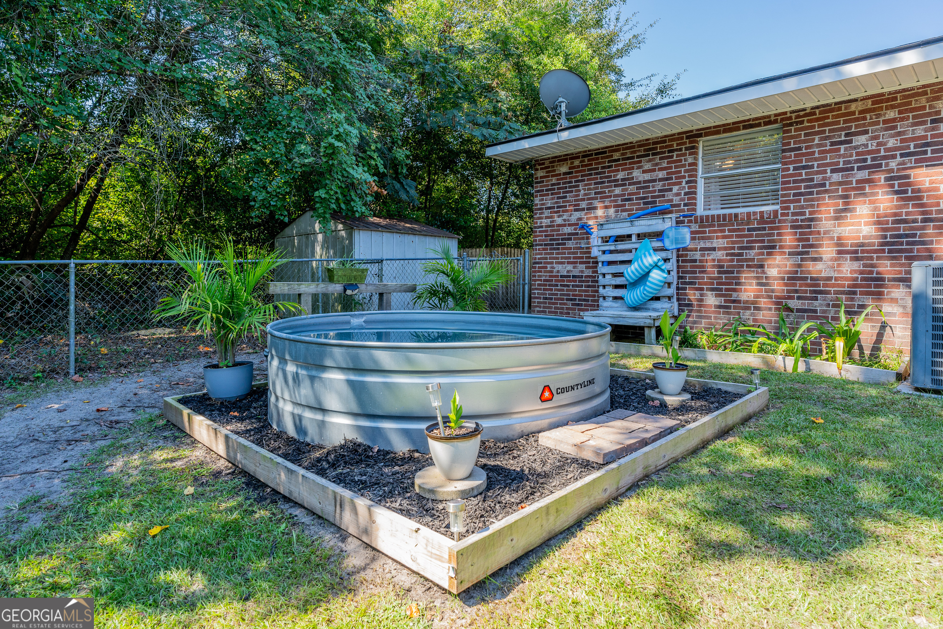 420 Jackson Street Blackshear, GA 31516 - Photo 9 of 31 a view of a backyard with sitting area