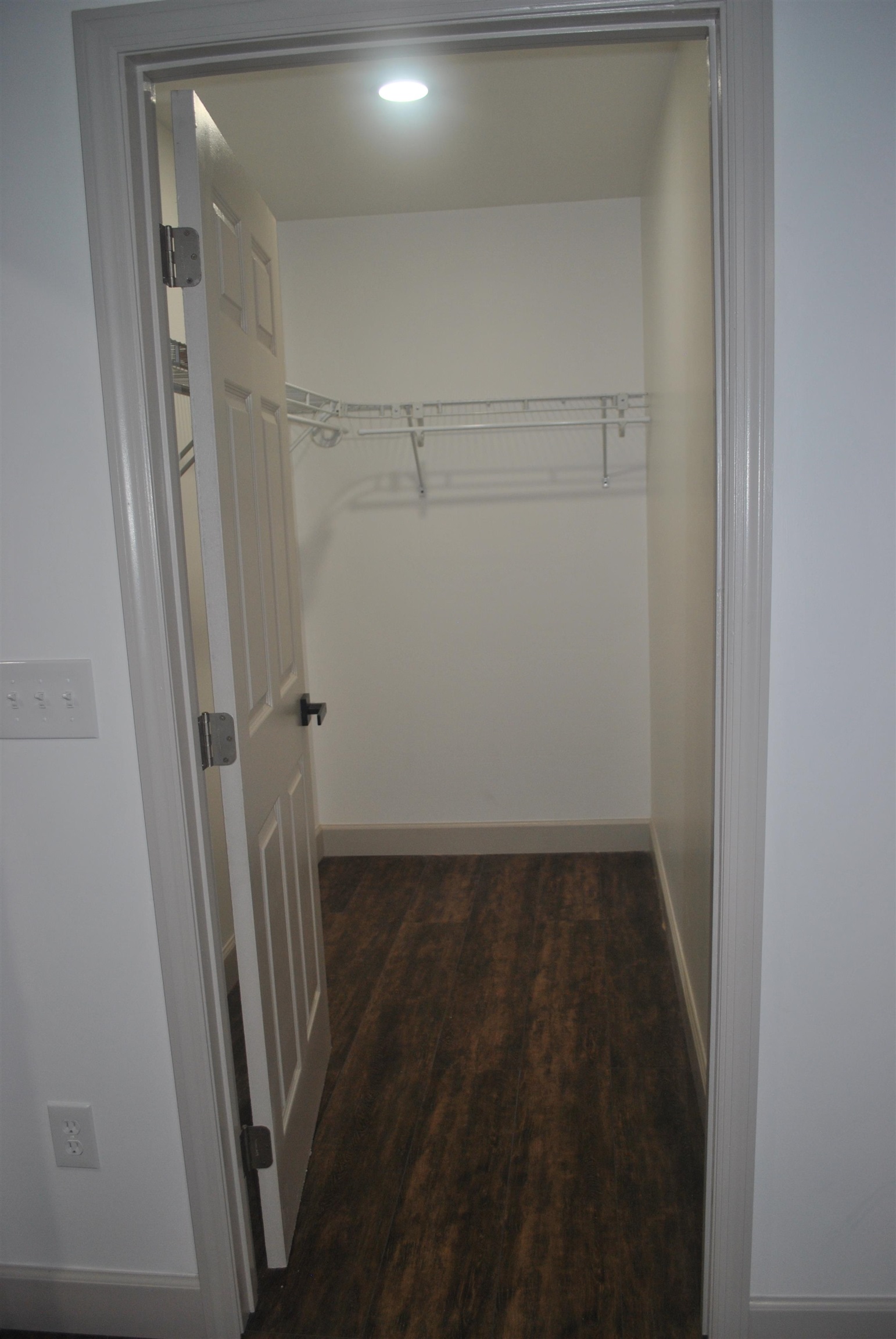 815 North Congdon Street Georgetown, SC 29440 - Photo 17 of 28 Master Bedroom Walk-in closet with dark wood finished floors