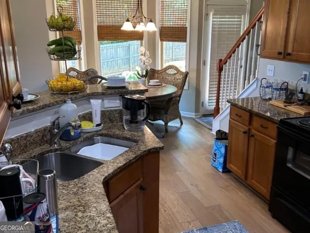 a dining room with furniture and a chandelier