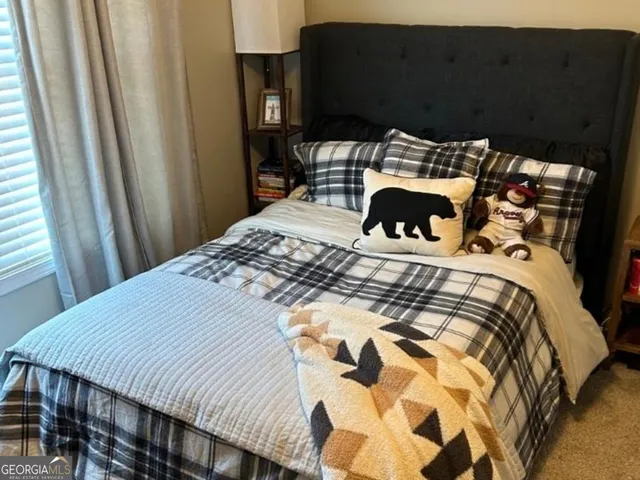 a bedroom with a bed and a fireplace