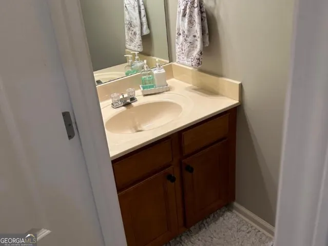 a bathroom with a sink and a mirror