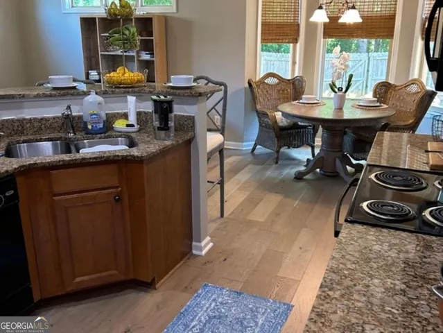 a view of a dining room with furniture window and outside view