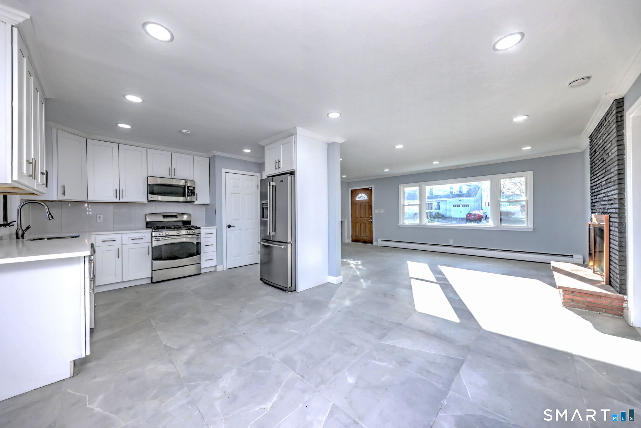 206 Bridgeview Place Stratford, CT 06614 - Photo 11 of 34 a open kitchen with white cabinets and stainless steel appliances