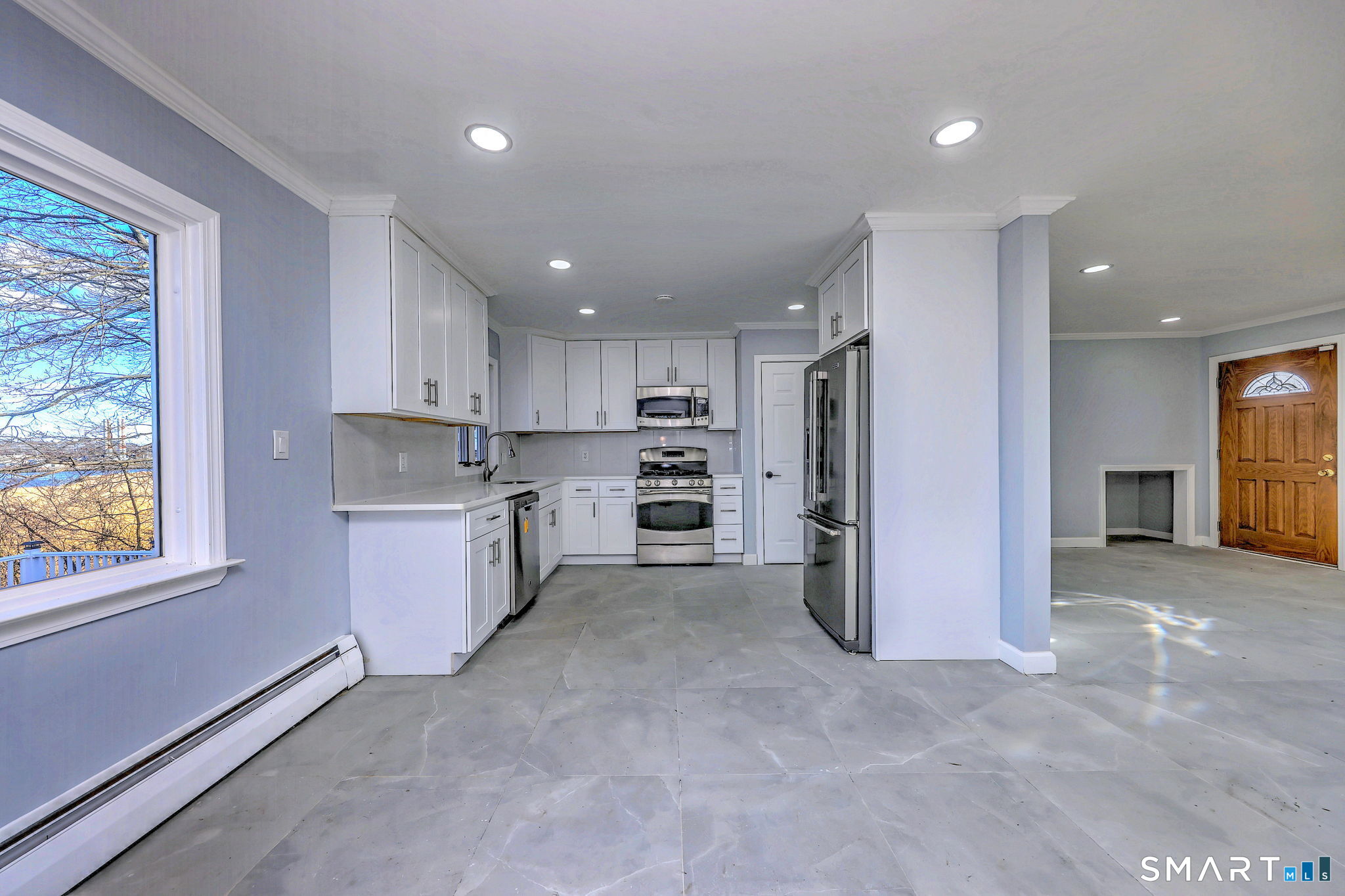 206 Bridgeview Place Stratford, CT 06614 - Photo 13 of 34 a large kitchen with a refrigerator and window