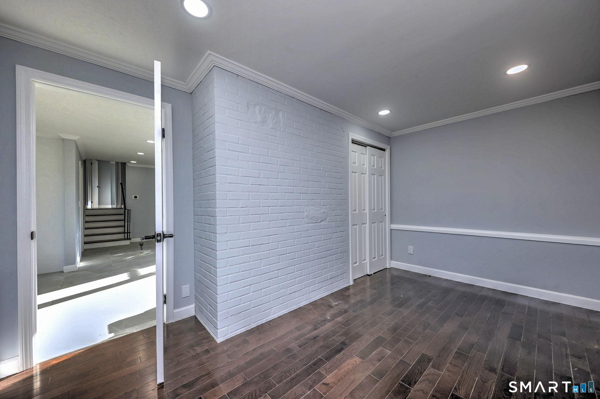 206 Bridgeview Place Stratford, CT 06614 - Photo 15 of 34 wooden floor in an empty room with a window