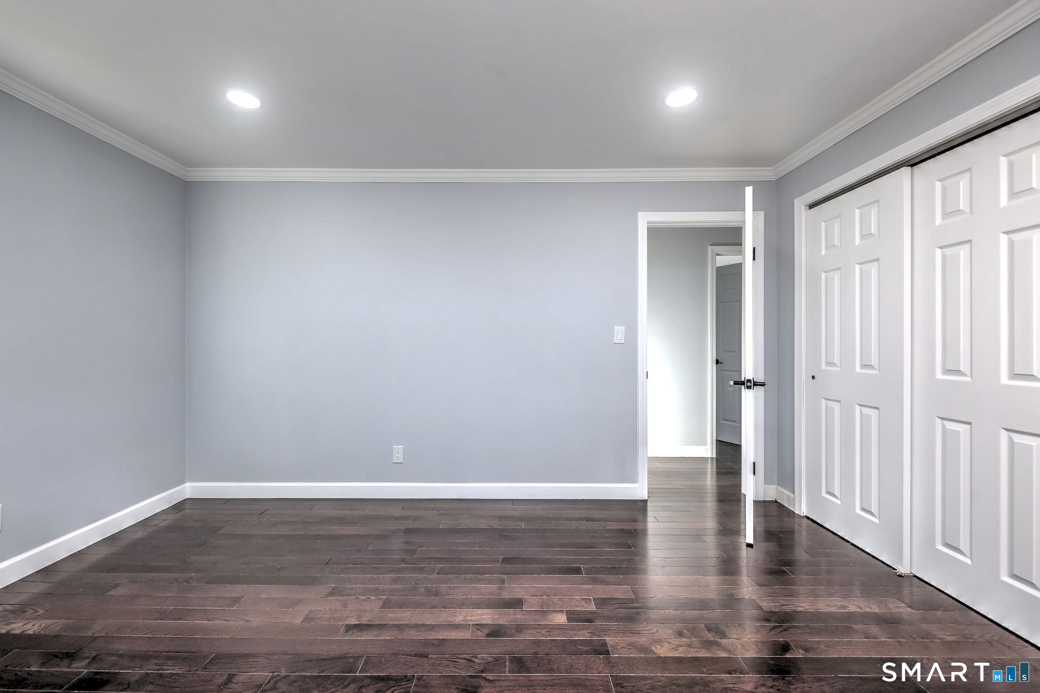 206 Bridgeview Place Stratford, CT 06614 - Photo 19 of 34 a view of an empty room with wooden floor