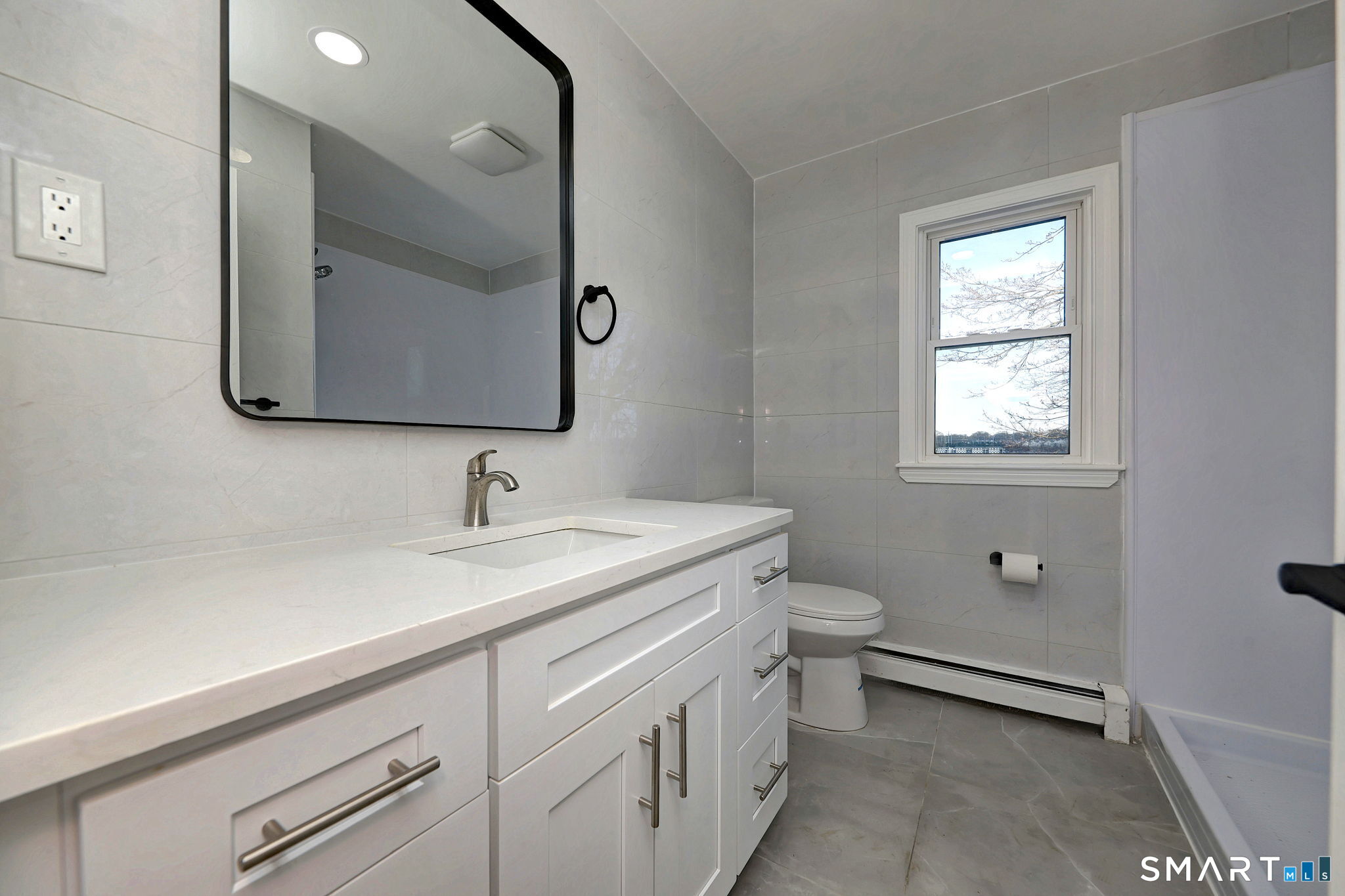 206 Bridgeview Place Stratford, CT 06614 - Photo 20 of 34 a bathroom with a toilet sink and mirror