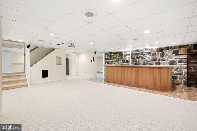 a view of a kitchen with a sink and cabinets