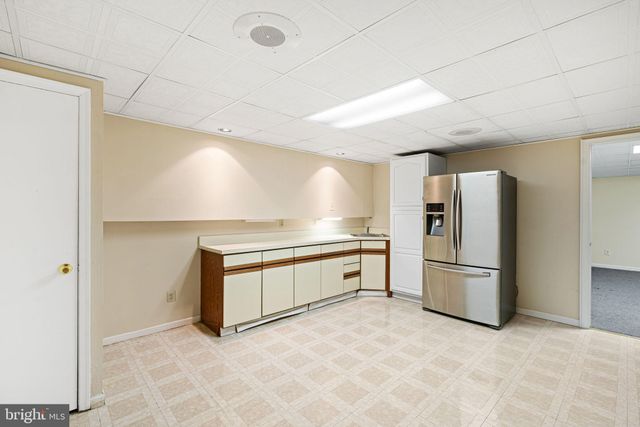 a kitchen with stainless steel appliances a refrigerator and a stove