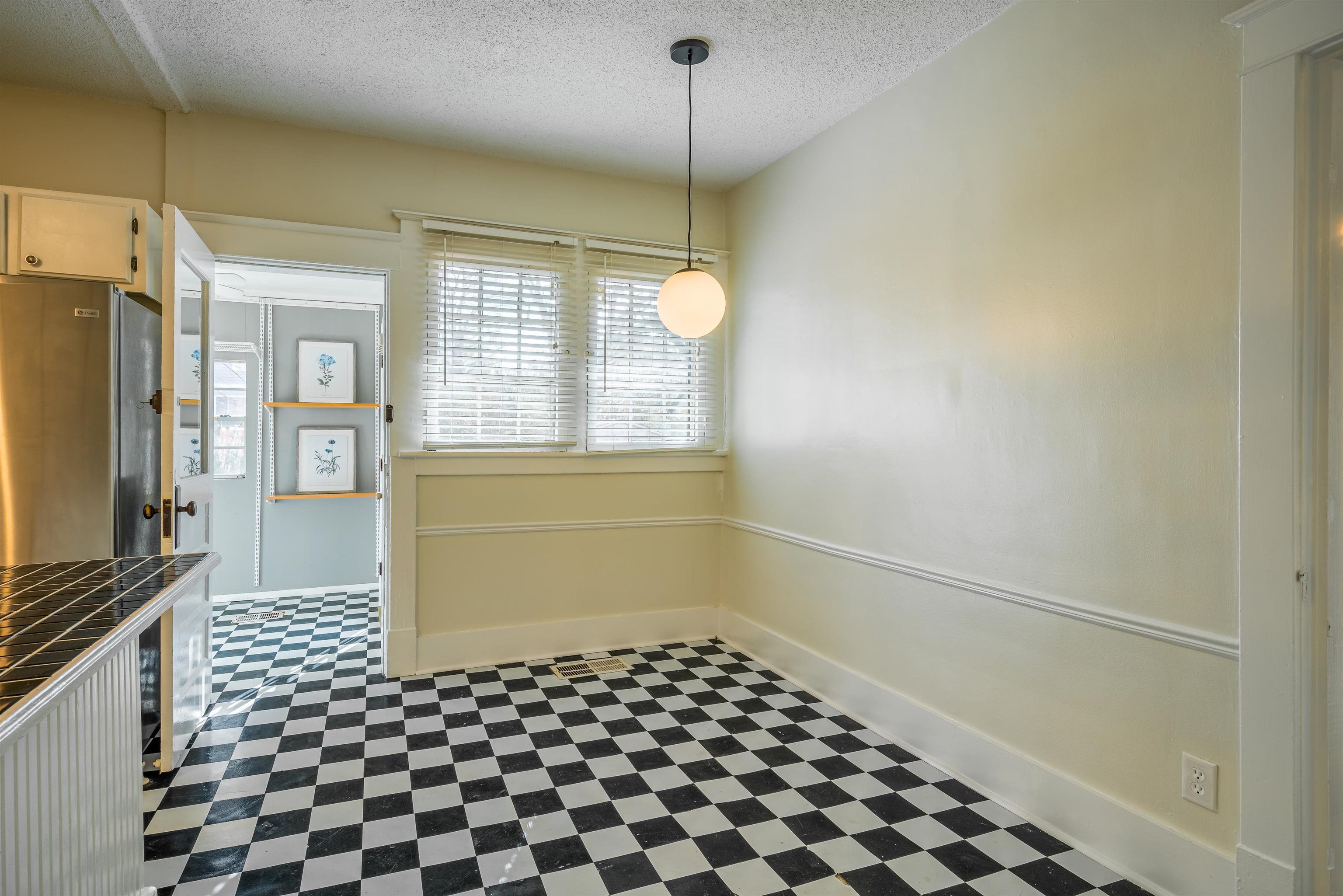 1997 Harbert Avenue Memphis, TN 38104 - Photo 11 of 23 a bathroom with a sink a vanity and a mirror