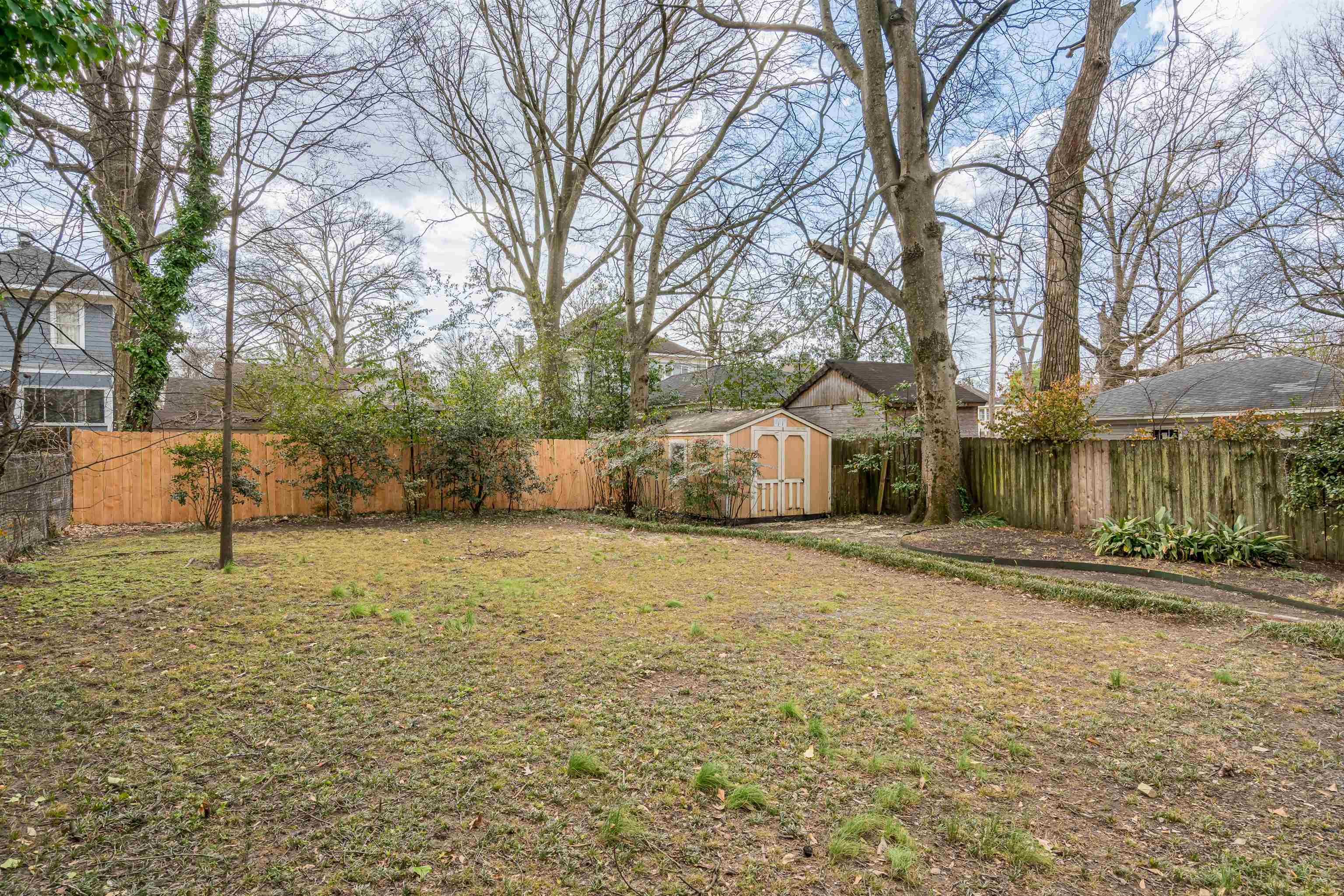 1997 Harbert Avenue Memphis, TN 38104 - Photo 20 of 23 a big house with trees in front of it