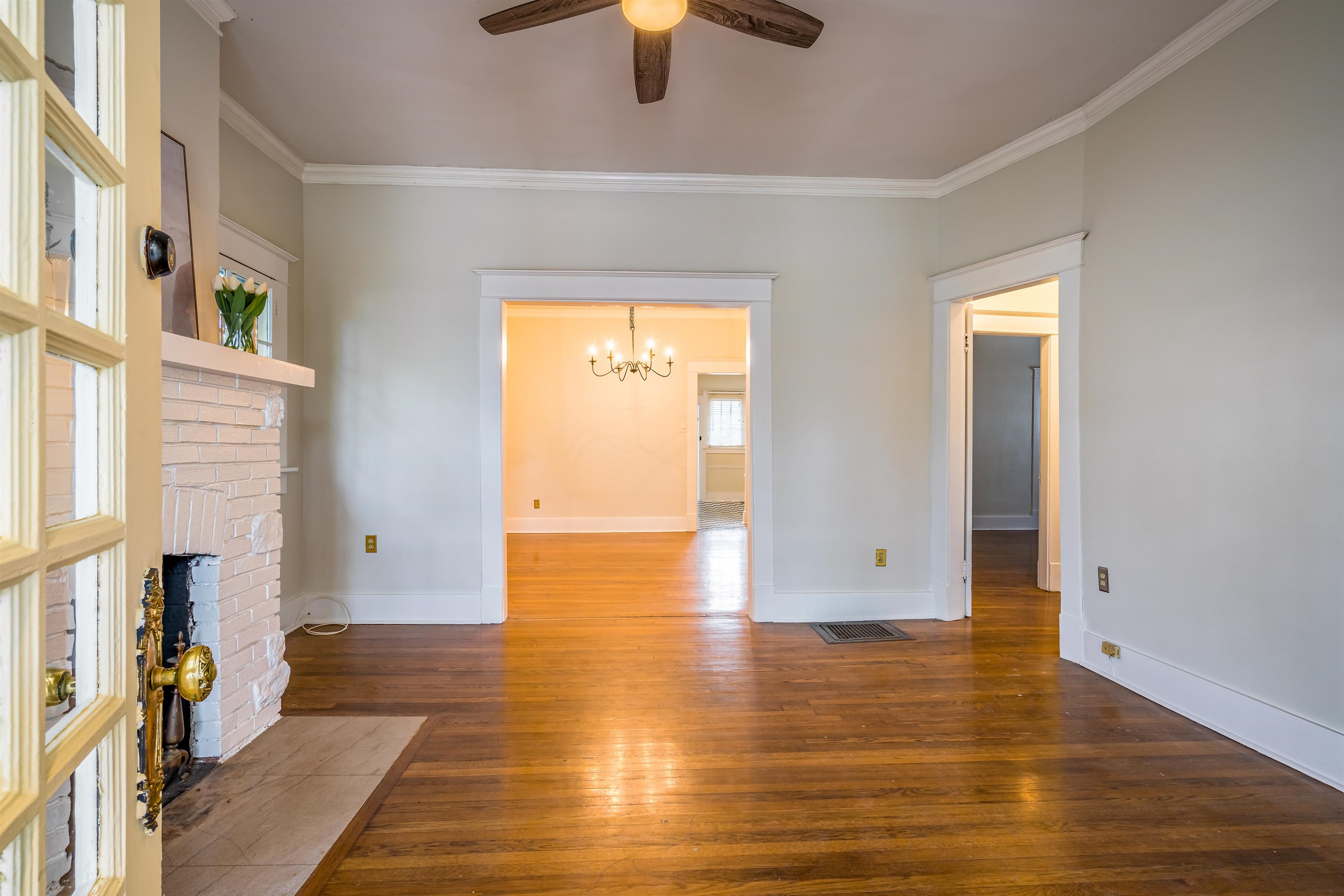 1997 Harbert Avenue Memphis, TN 38104 - Photo 3 of 23 a view of empty room with wooden floor and fan