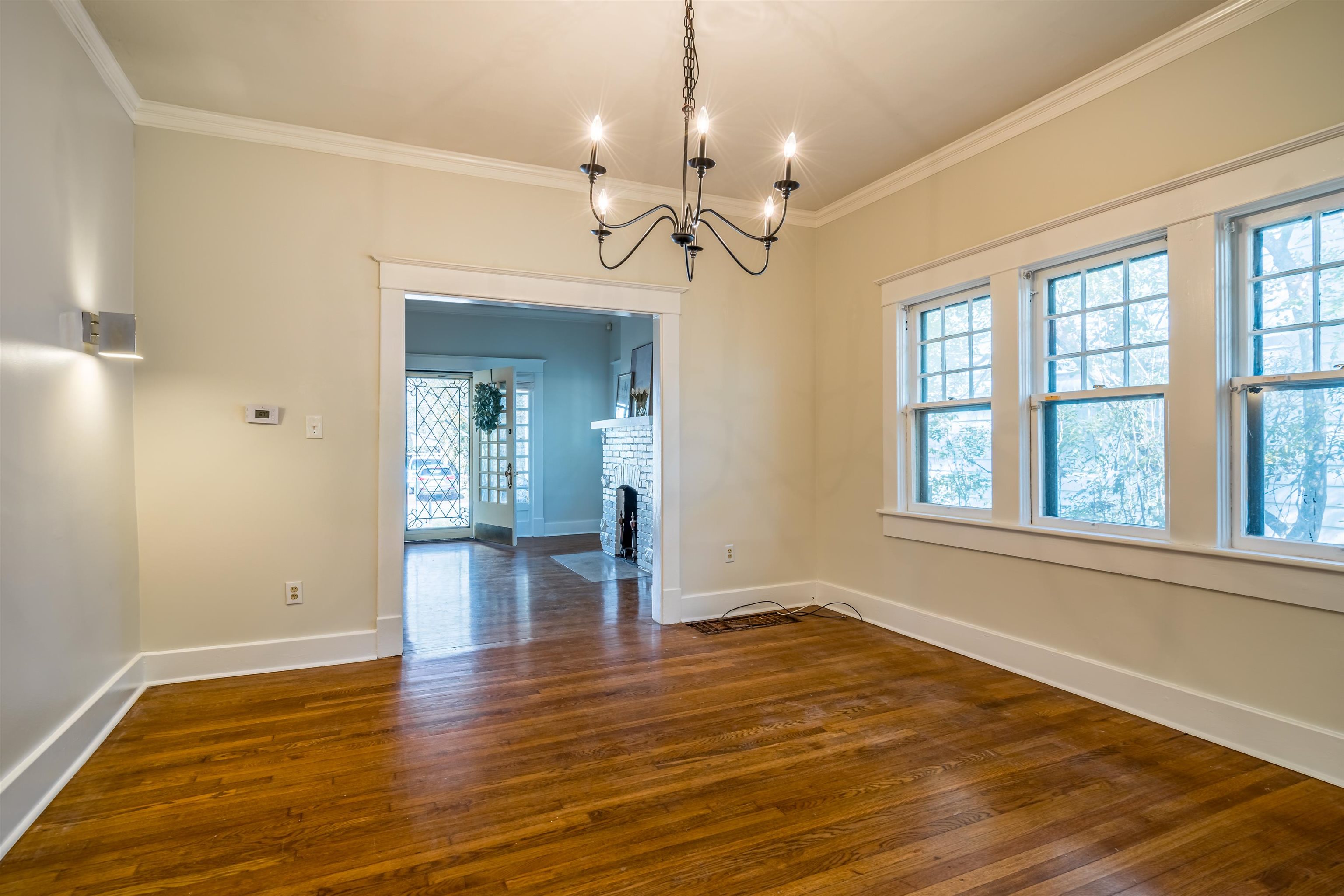 1997 Harbert Avenue Memphis, TN 38104 - Photo 7 of 23 a view of empty room with wooden floor and fan