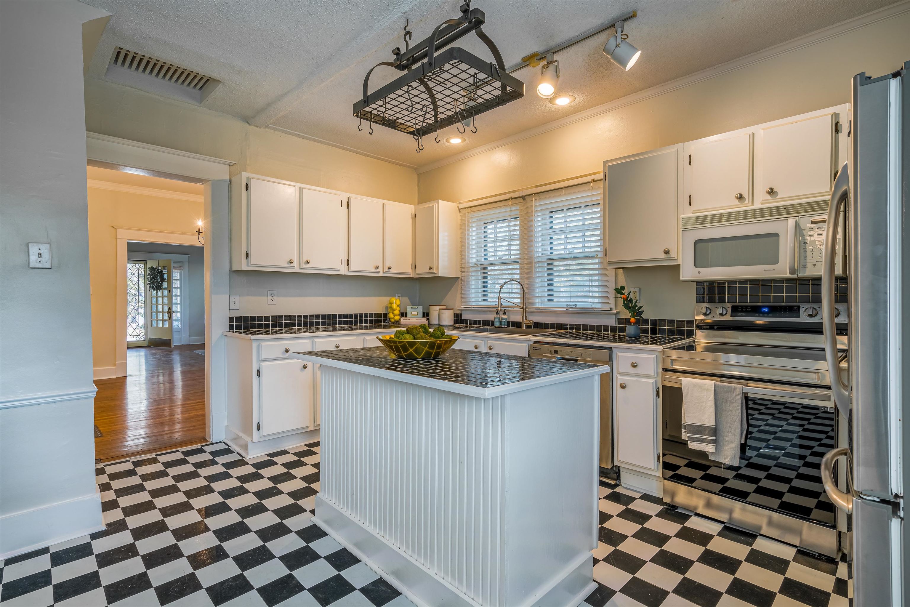 1997 Harbert Avenue Memphis, TN 38104 - Photo 10 of 23 a kitchen with stainless steel appliances a stove sink and microwave
