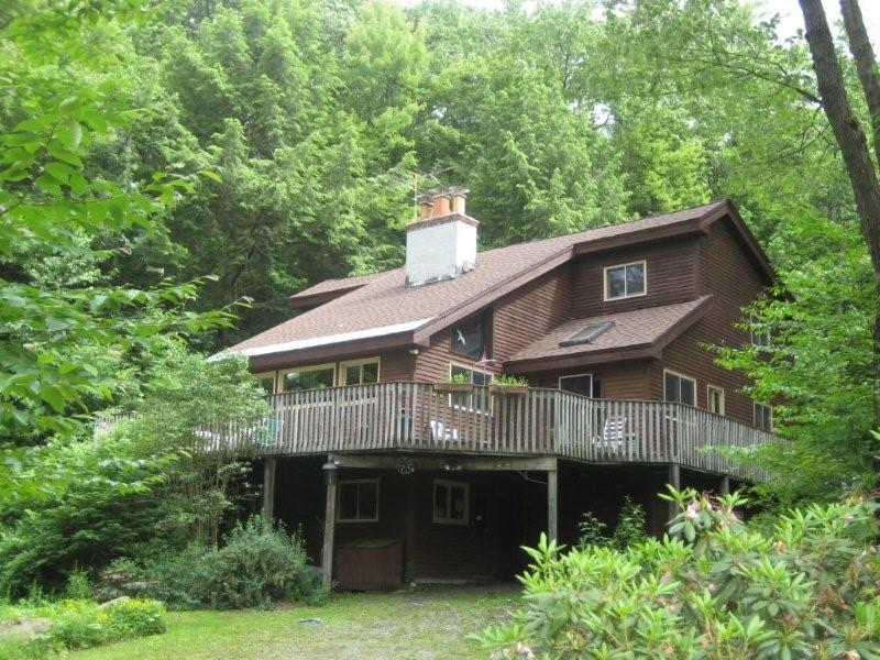 76 Tyringham Road Otis, MA 01253 - Photo 1 of 6 a house view with a garden space