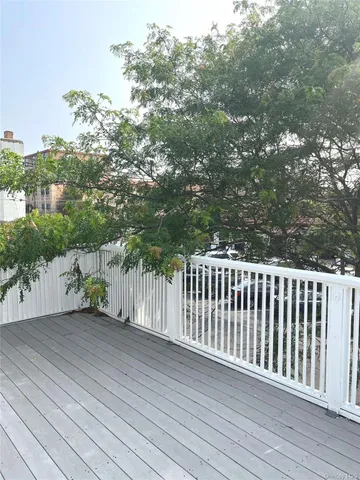 a balcony with wooden floor