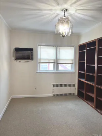 an empty room with a empty space and windows