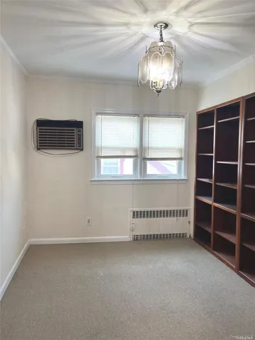 an empty room with a empty space and windows