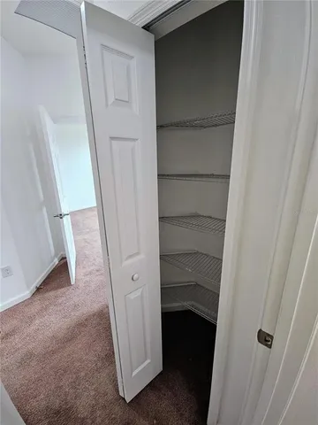 a view of a swimming pool with a lounge chairs