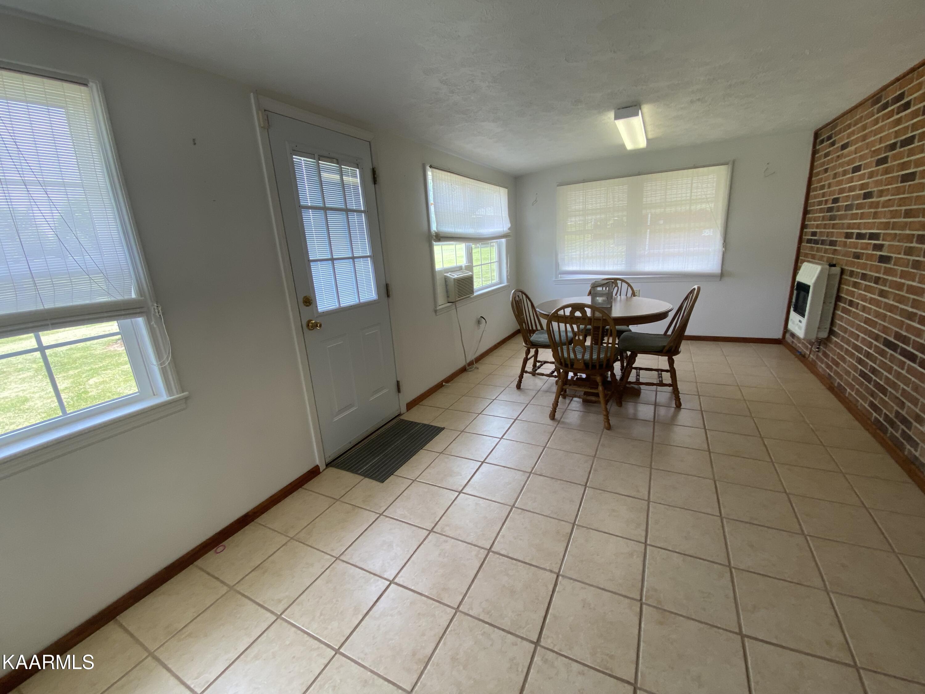 6002 Wilderness Road Ewing, VA 24248 - Photo 16 of 22 sunroom