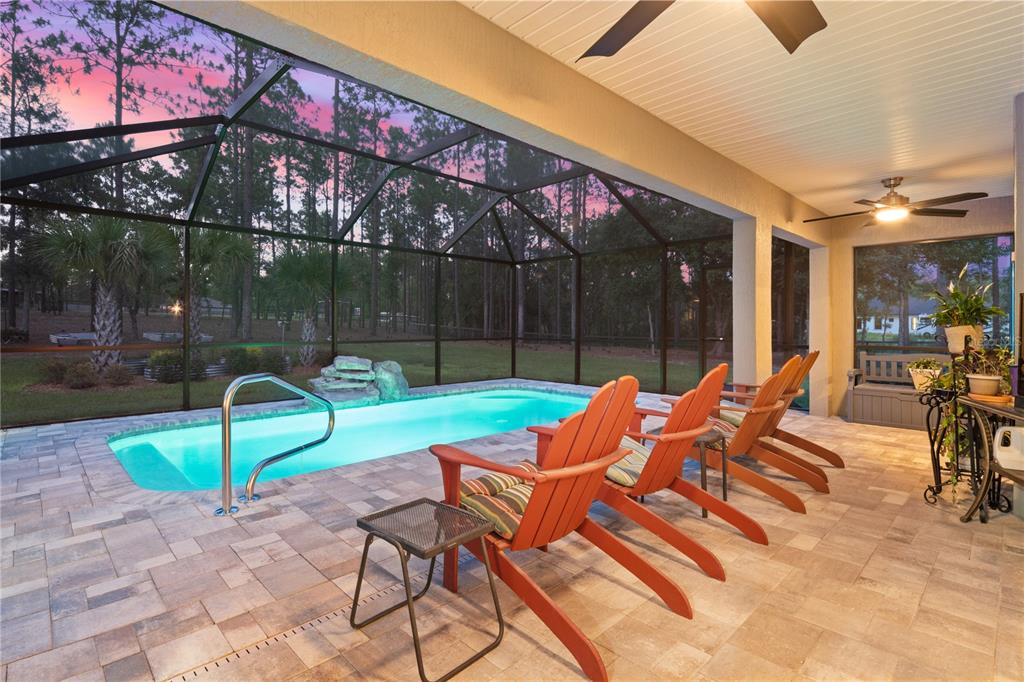 12929 Southwest 89th Street Dunnellon, FL 34432 - Photo 50 of 76 a backyard of a house with barbeque oven table and chairs