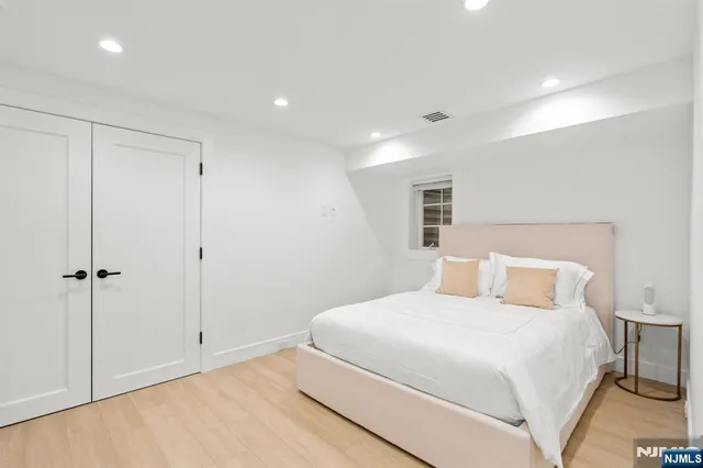 a bedroom with a bed and a closet